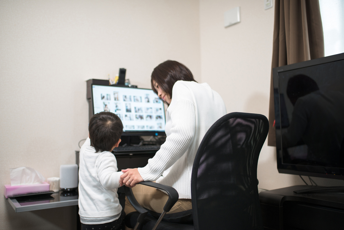 Mother and child watching PC together